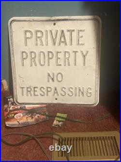 A Vintage Portion Paint Covered No Trespassing Sign