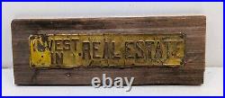 Vintage INVEST IN REAL ESTATE Embossed Painted Metal Advertising Sign Antique