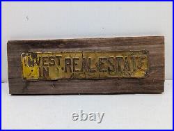 Vintage INVEST IN REAL ESTATE Embossed Painted Metal Advertising Sign Antique