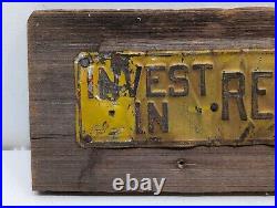 Vintage INVEST IN REAL ESTATE Embossed Painted Metal Advertising Sign Antique