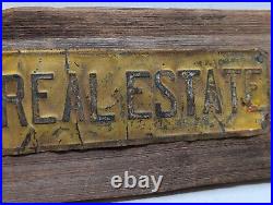 Vintage INVEST IN REAL ESTATE Embossed Painted Metal Advertising Sign Antique