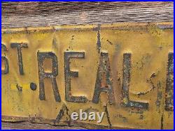 Vintage INVEST IN REAL ESTATE Embossed Painted Metal Advertising Sign Antique